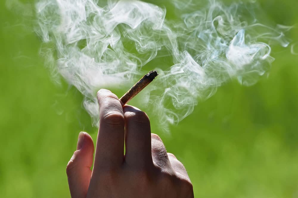hand of a person smoking a joint